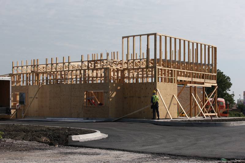 Crews begin on erecting the walls of the new Popeye's location next to Super 8 on Monday, Aug. 2024 in Peru.