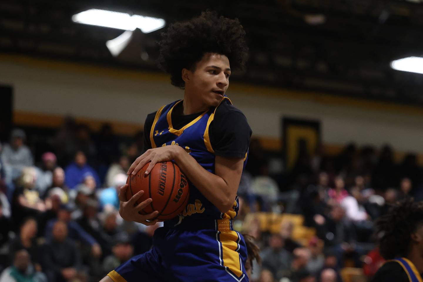 Joliet Central’s Zion Kostra pulls in the rebound against Joliet West on Tuesday, Nov. 28, 2023 in Joliet.