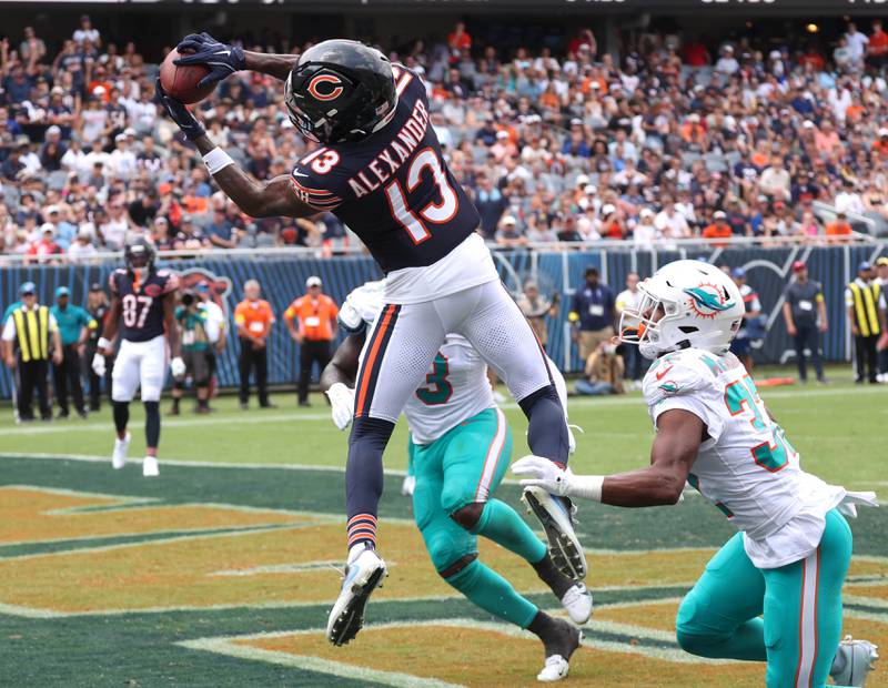 Chicago Bears wide receiver Maurice Alexander makes a touchdown catch behind two Miami Dolphin defenders Sunday, Aug. 10, 2025, during their preseason game at Soldier Field in Chicago.