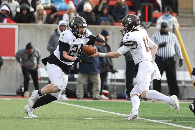 Joliet Catholic’s Larry Stringham takes the handoff from Lucas Simulick against Nazareth in the Class 5A state championship on Saturday, Nov. 30, 2024 in Normal.