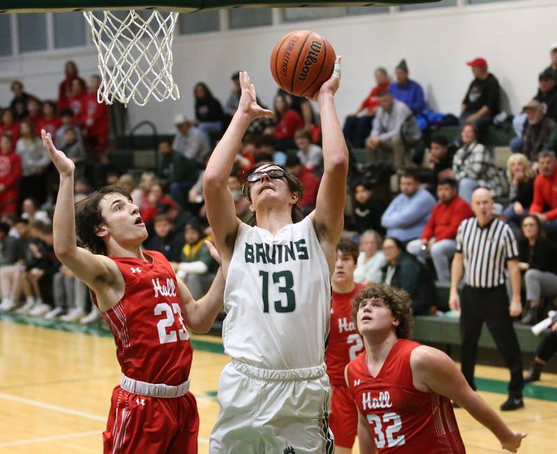 St. Bede's Landon Jackson (center) posts up in the lane to score a bucket over Hall's Braden Curran (left) on Monday, Dec. 14, 2022 at St. Bede Academy.