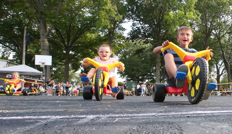 Joseph Sment (right) of Spring Valley, wins the 6-year-old Big Wheel Race during the National Night Out event on Tuesday, Aug. 1, 2023 in Spring Valley.