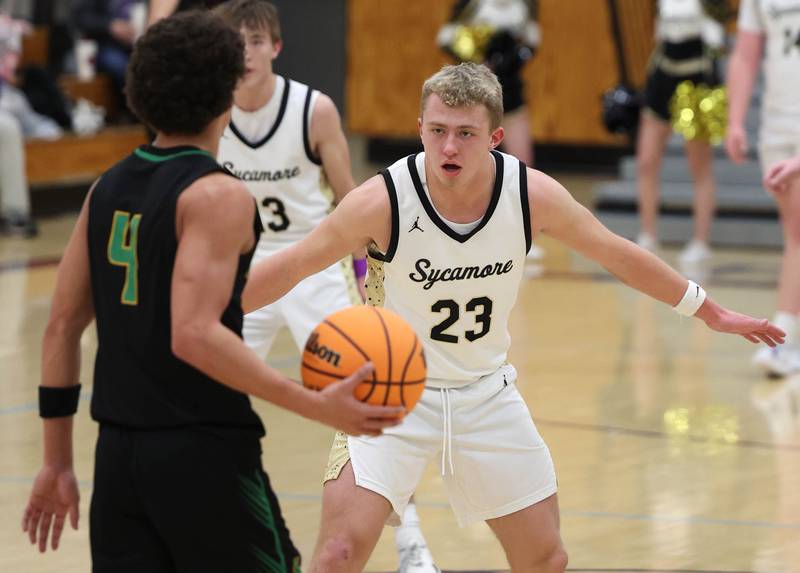 Sycamore's Carter York plays defense against Crystal Lake South's AJ Demirov during their sectional semifinal game Tuesday, March 4, 2025, at Rochelle High School.