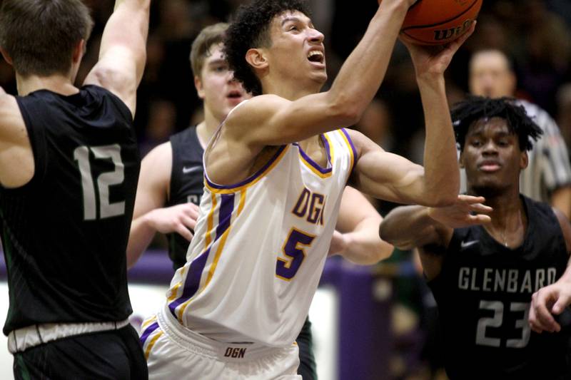 Downers Grove North’s Jacob Bozeman attempts a shot during a game against Glenbard West at Downers Grove North on Friday, Jan. 13, 2023.