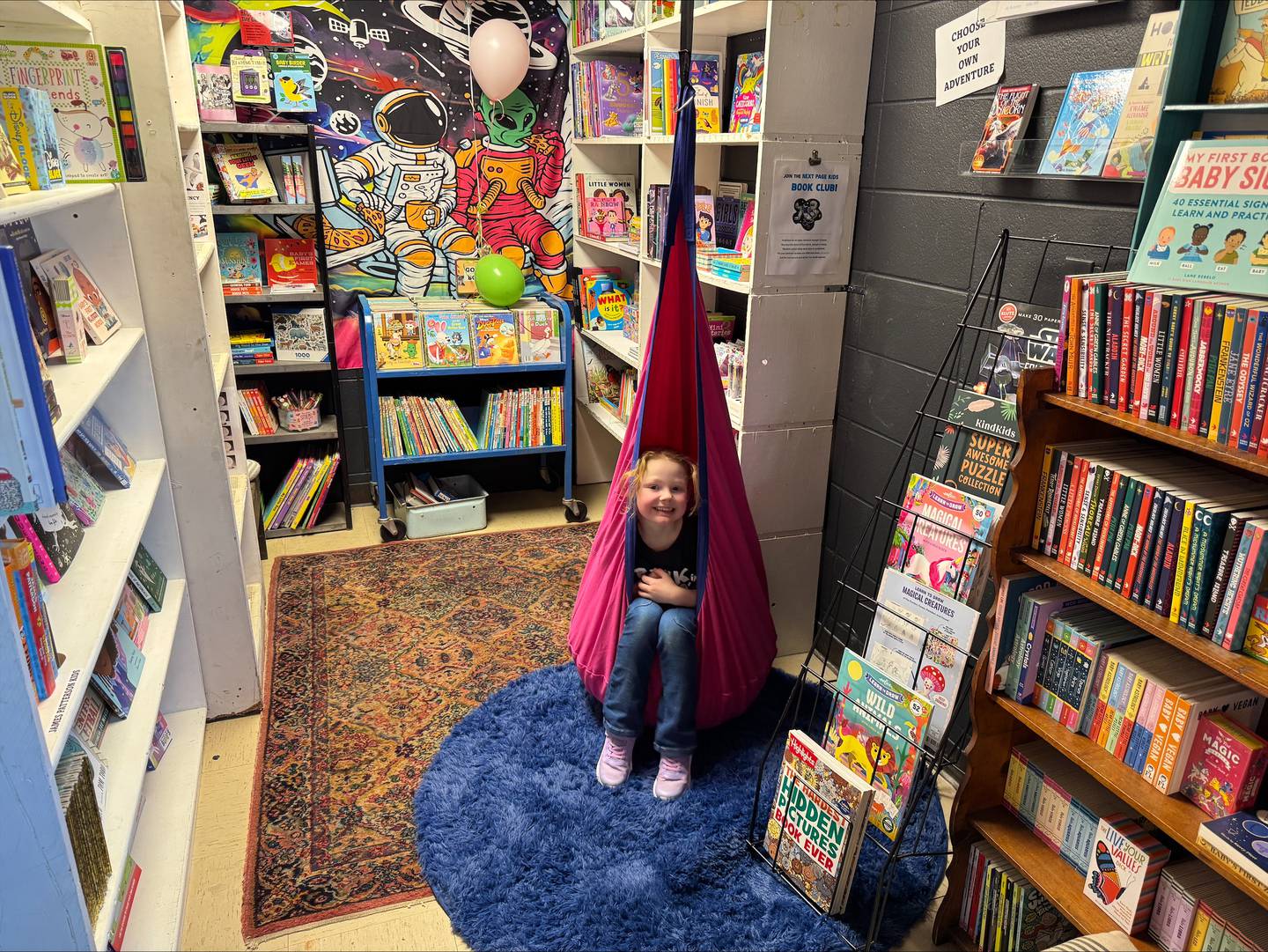 Tayah Anderson plays in the kids’ corner at Next Page bookstore inside True North Building 2, 1338 Clay St., Morris.