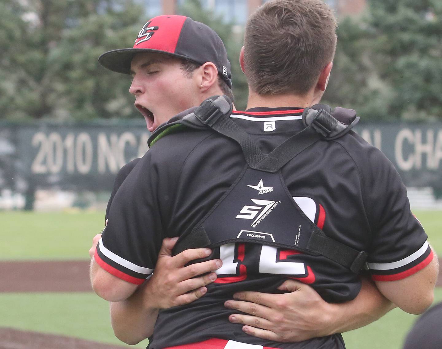 Henry-Senachwine pitcher Lance Kieswetter hugs catcher Colton Williams after defeating Milford during the Class 1A Supersectional game on Monday, May 29, 2023 at Illinois Wesleyan University in Bloomington.