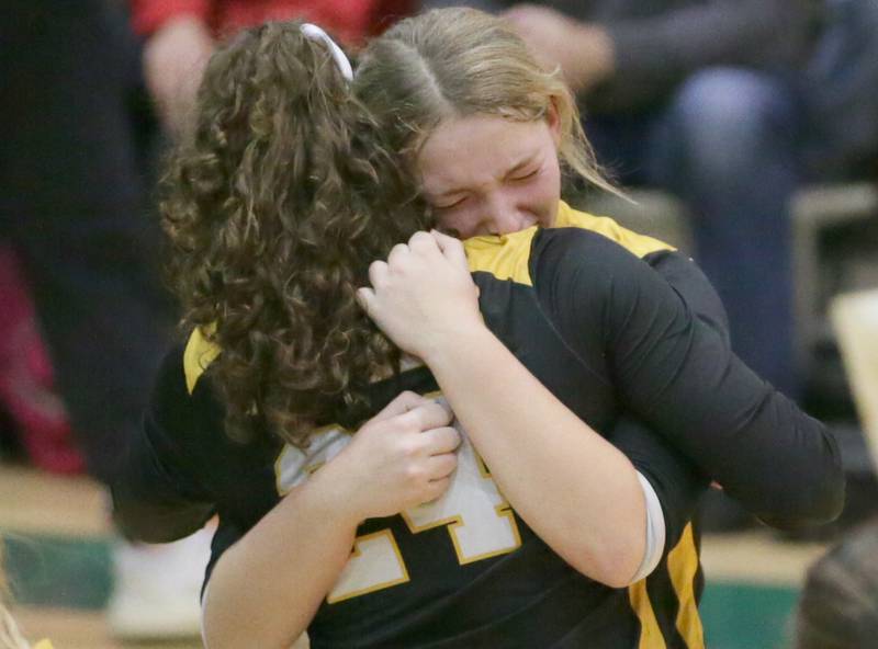 Putnam County's Tori Balma reacts while hugging teammate Maggie Richetta after loosing to Newark in the Class 1A semifinal game on Wednesday, Oct. 16, 2022 at St. Bede Academy in Peru.