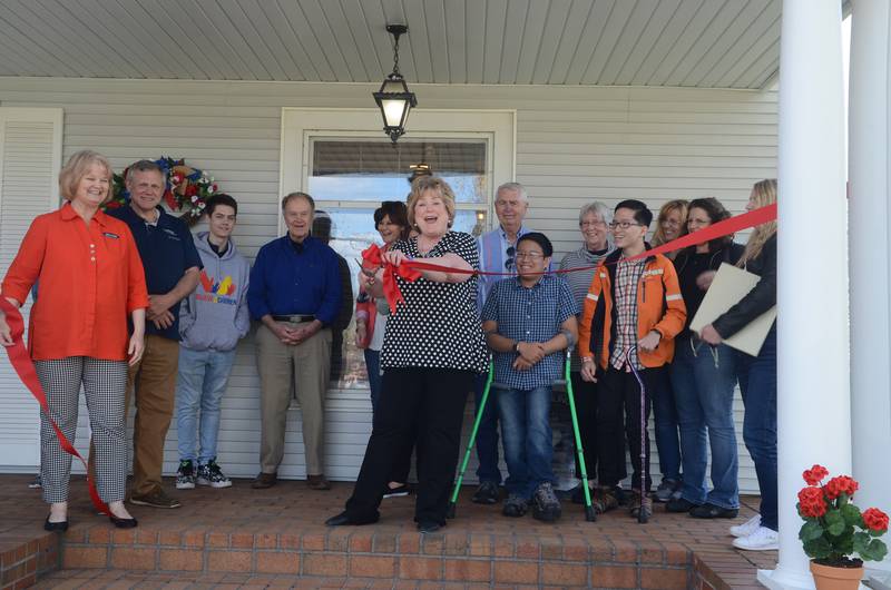 Believe in the Children held its grand opening for the 310 Sibling Home in Forreston on Saturday. Pictured at center is Executive Director Patti Jennings. She's flanked by other organization representatives and family members of the original home owners.