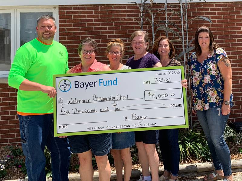 The Bayer Fund giving a grant check of $5,000 to the Waterman Community Chest.