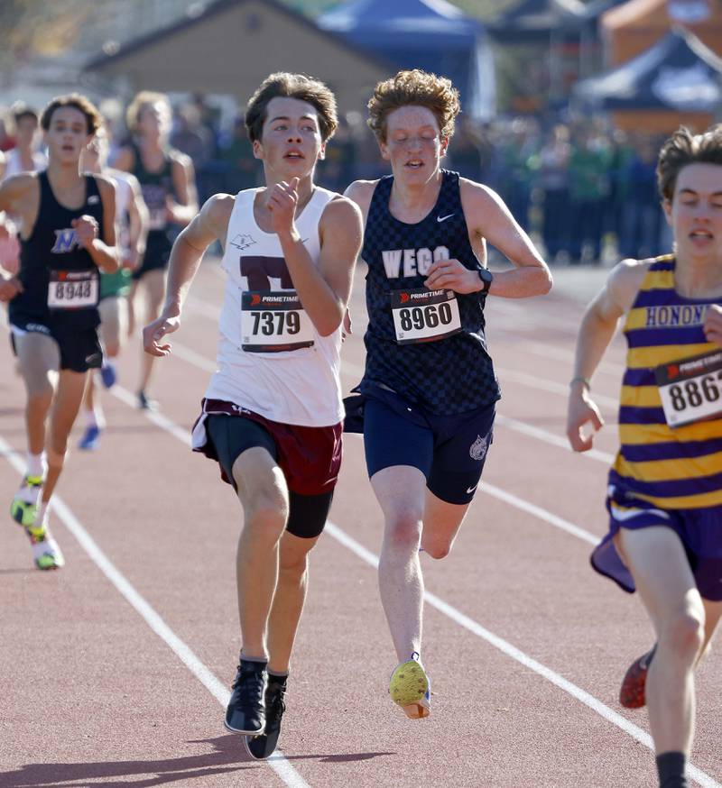 Cole Tupper of Elgin, left, and Judah McLean of West Chicago during the IHSA Class 3A Lake Park cross country sectional  Saturday, Nov. 2, 2024 in Roselle.