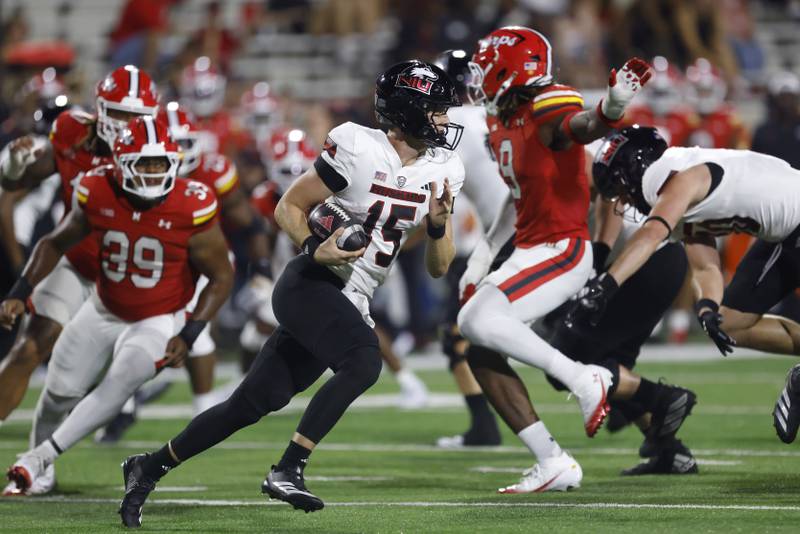 Northern Illinois quarterback Josh Holst (15) in action during an NCAA football game against Maryland on Friday, Sept. 5, 2025, in College Park, Md. Maryland won 20-9. (AP Photo/Mike Buscher)