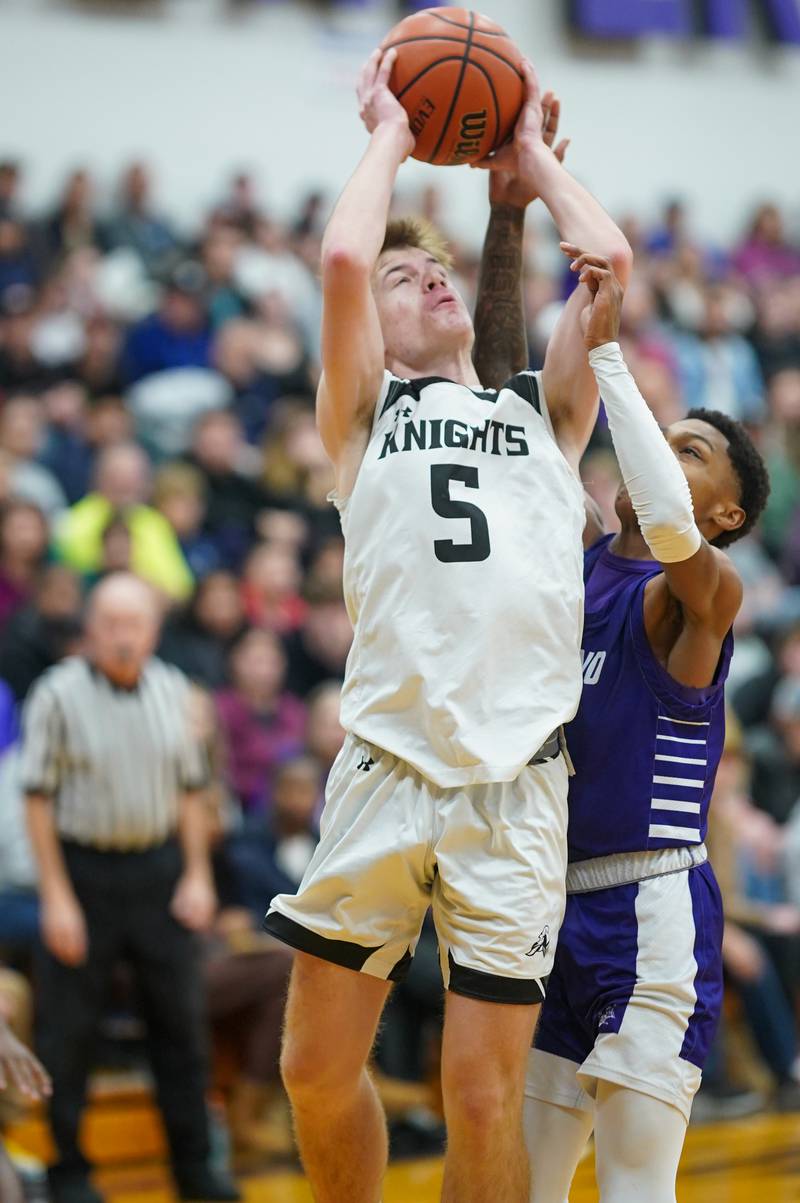 Kaneland's Brad Franck (5) shoots the ball in the post against Plano during a championship game of the 60th annual Plano Christmas Classic Basketball Tournament at Plano High School on Saturday, Dec 30, 2023.