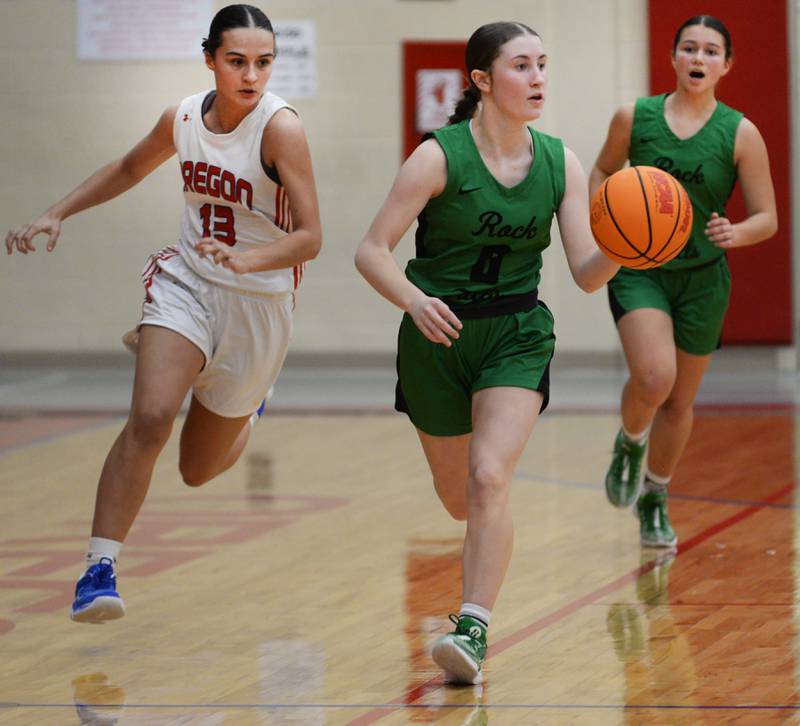 Rock Falls' Miley Bickett (0) dribbles up the court as Oregon's Sarah Eckardt (13) gives chase during 2A regional action on Saturday, Feb. 15, 2025 at Oregon High School.