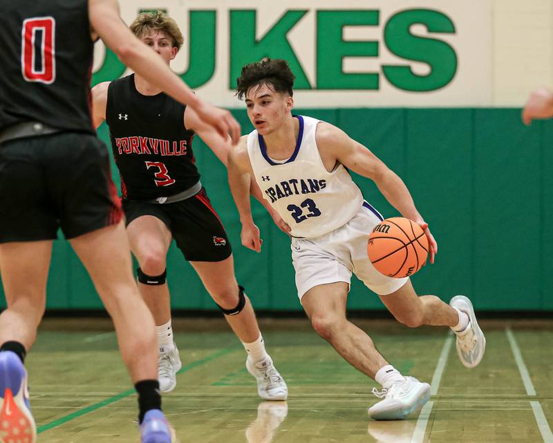 St Francis Mark Balaskovits (23) drives past the defense during their Jack Tosh Holiday Classic basketball tournament game between St Francis at Yorkville Thursday Dec 26, 2024 in Elmhurst.