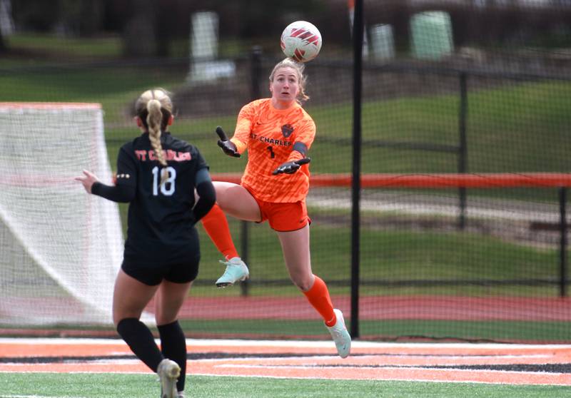 St. Charles East goal keeper Sidney Lazenby makes a save during a game on Tuesday, April 1, 2025 against Burlington Central in St. Charles.