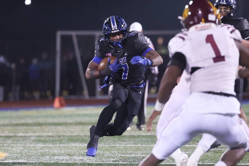 Lincoln-Way East’s Zion Gist rushes against Loyola in the Class 8A semifinal on Saturday, Nov. 23, 2024 in Frankfort.