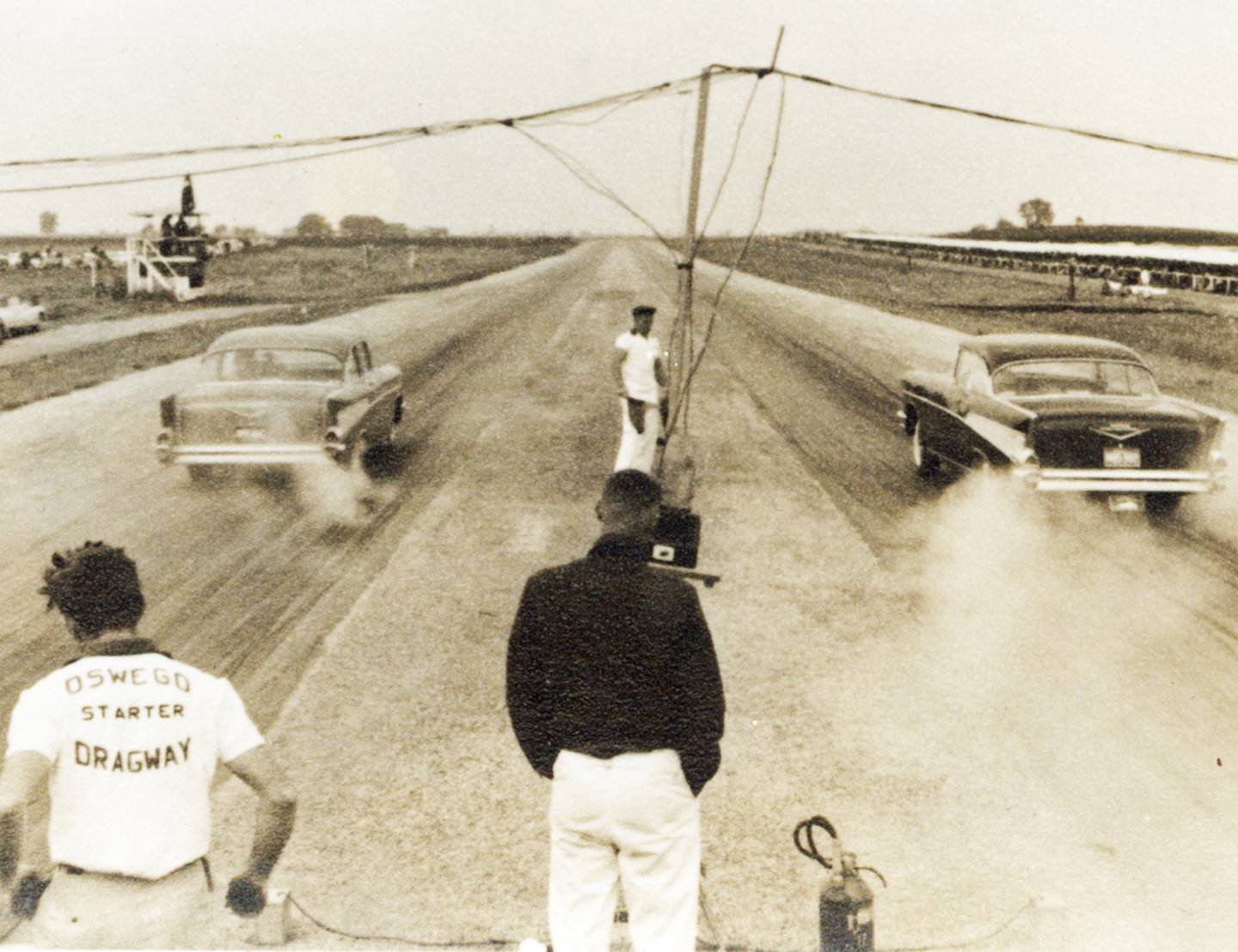 On a Sunday in 1957, just a couple years after the Oswego Drag Raceway opened, two new ’57 Chevys burn off the line during a race at "The Strip." Join other Oswego Drag Raceway fans on Thursday, Aug. 11, at 6:30 p.m. at the Oswego Brewing Company, 61 Main St., Oswego, for “History Happy Hour – Oswego Drag Raceway,” an hour of discussion and reminiscences about the raceway that drew thousands of fans to Oswego weekly.