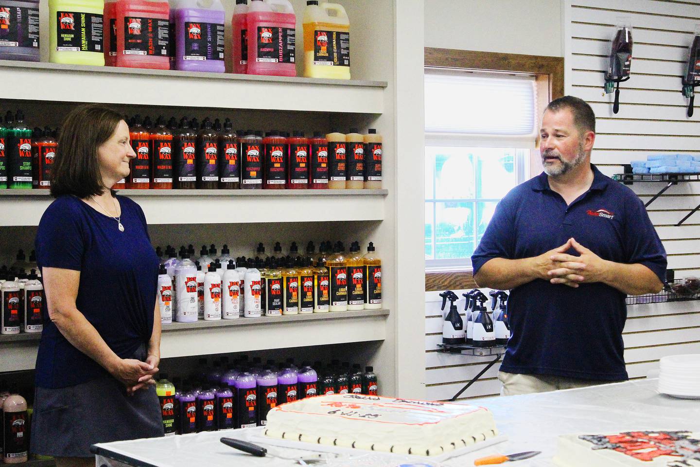 Brian and Donna Caldwell talk about their business, AutoSmart, in Freeport during its grand opening ceremony on June 11, 2025.