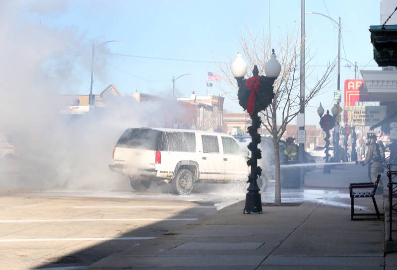 Princeton firefighters extinguish flames from a vehicle fire in the 500 block of South Main Street on Monday, Nov. 21, 2022 in Princeton. The fire began around 10:45a.m.