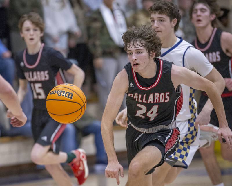 Jacob Miller of Henry-Senachwine chases down a lose ball during the game against Marquette on February 7, 2025 at Bader Gym.