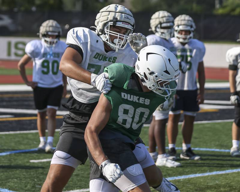 Costa Kampas goes through one on one blocking drills at York High School football practice, Thursday, Aug 14, 2025  in Elmhurst.