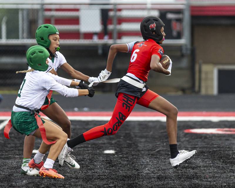 Bolingbrook's Kennedy Williams (6) runs away from the defense during flag football game between Plainfield Central at Bolingbrook Wednesday, Sept 3, 2025  in Bolingbrook.