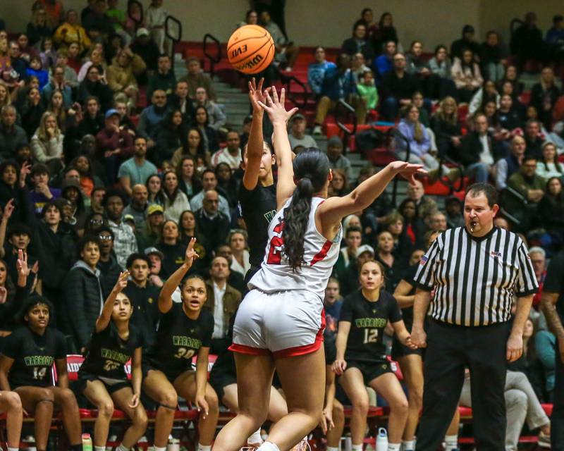 Waubonsie Valley's Maya Pereda (0) shoots a jumper during their Class 4A Bolingbrook Sectional final basketball game between Waubonsie Valley at Benet. Feb 27, 2025 in Bolingbrook.