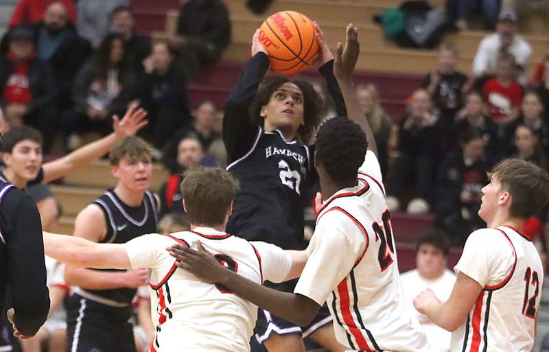 Hampshire’s Jaiden Baldwin takes a shot in varsity boys basketball on Friday, Dec. 19, 2025, at Huntley High School in Huntley.