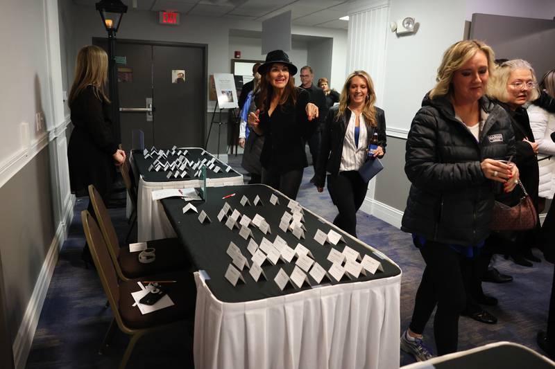 People arrive at the Shorewood HUGS "Sweet Home Chicago" chocolate ball fundraiser in Joliet on Saturday, February 4, 2023.