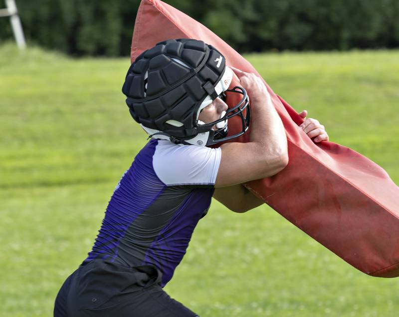 LJ Knigge hits the bag Monday, August 11, 2025, for the first day of Dixon football practice.