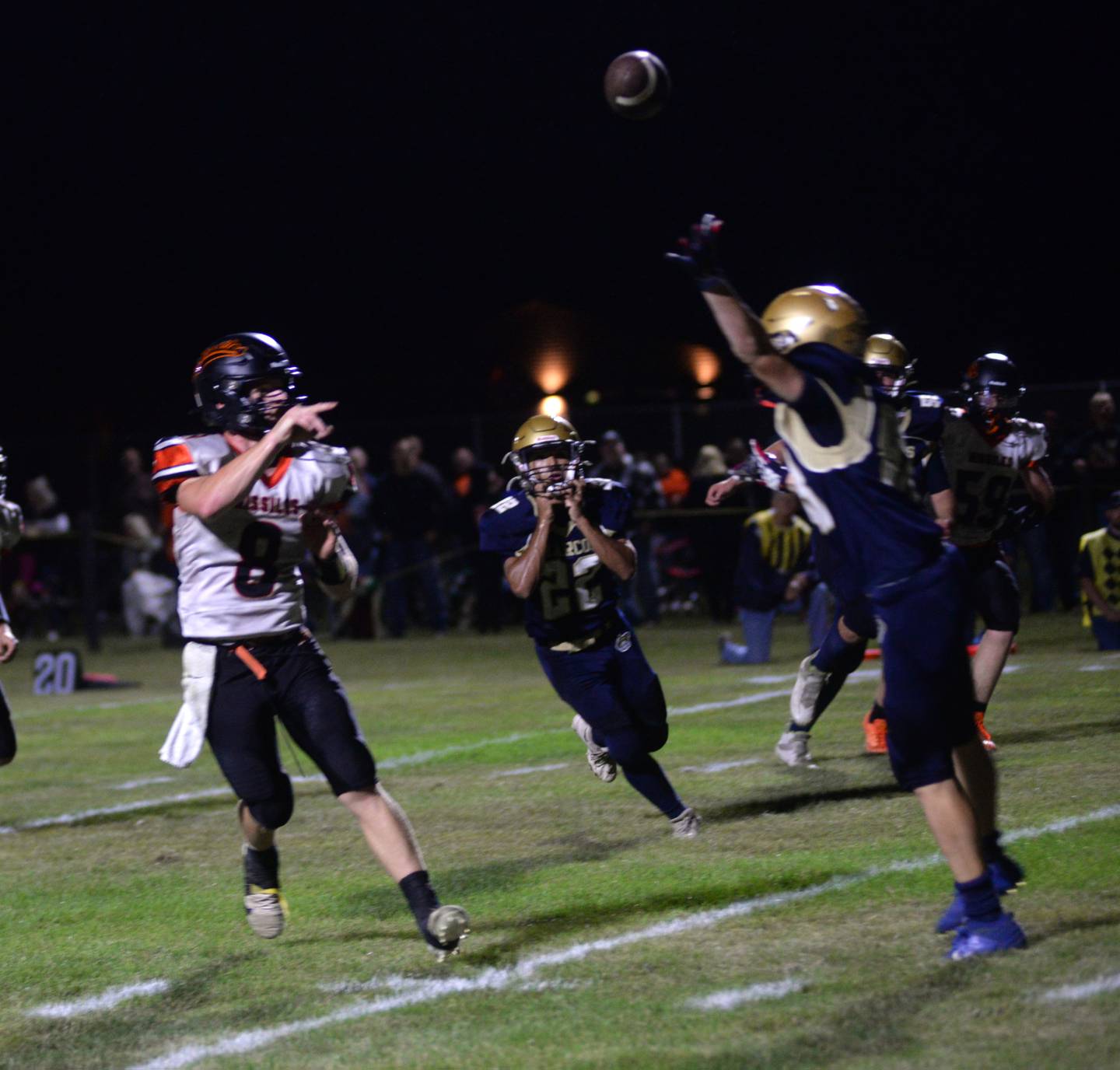 Milledgeville quarterback Connor Nye (8) floats a pass over a Marcos rusher during a Friday, Sept. 8, 2023 game at Polo High School.