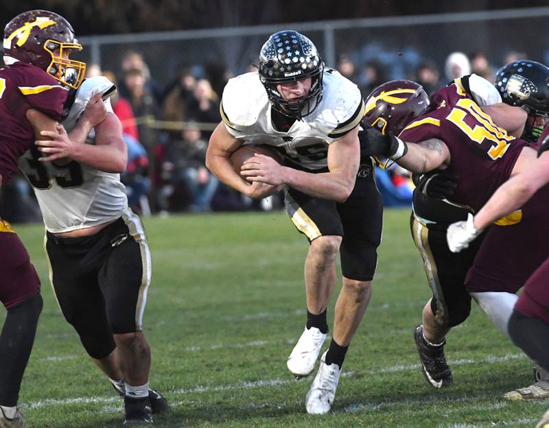 Lena-Winslow's Aiden Wild (85) hits a gap for a big gain against Stockton in 1A semifinal action in Stockton on Saturday, Nov. 22, 2025. He rushed for 190 yards in the game.