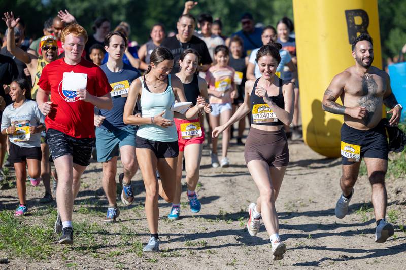 Participates of the 2025 Muddy Dash run on Saturday, June 28, 2025 at Fox Valley Off Road in Utica.