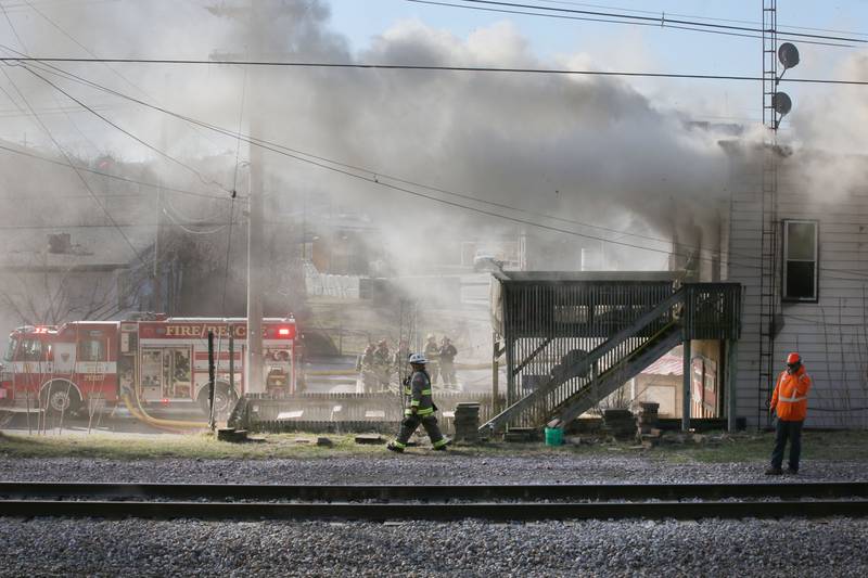 Firefighters work the scene of a structure fire at the former Platform 31 tavern on Monday, March 24, 2025 on Water Street in Peru. The fire was upgraded to a three-alarm summing ire departments from La Salle, Utica, Mendota, Tonica, Ottawa, Ladd, Spring Valley, Lostant, Cedar Point, Troy Grove and Peru responded to the fire.