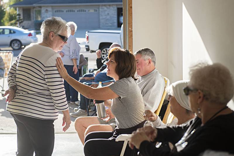 Nancy Butler (right) chats with Jane Freres during the party. The party goes into hiatus after the summer months.