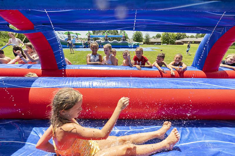 A camper slides by her new SPARK friends Tuesday, June 18, 2024 in Dixon. Another SPARK camp is schedule in July. Those interested can sign up on the Dixon Park District website.