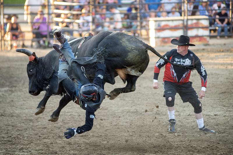 Cody McCandless gets thrown from his bull August 16, 2022 during action at the Whiteside County fair. The Next Level Pro Bull Riding tour made a stop Tuesday in Morrison.