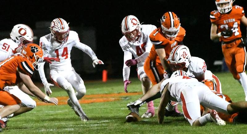 Oregon's Logan Embrick (14), Braylon Carlson (40), Ethan Reed (22), and Jakobi Donegan (4) react to a loose ball during 3A football playoff action against Byron on Friday, Oct. 31, 2025 at the Everett Stine Stadium in Byron. The Tigers won the game 63-15 to advance to the next round.