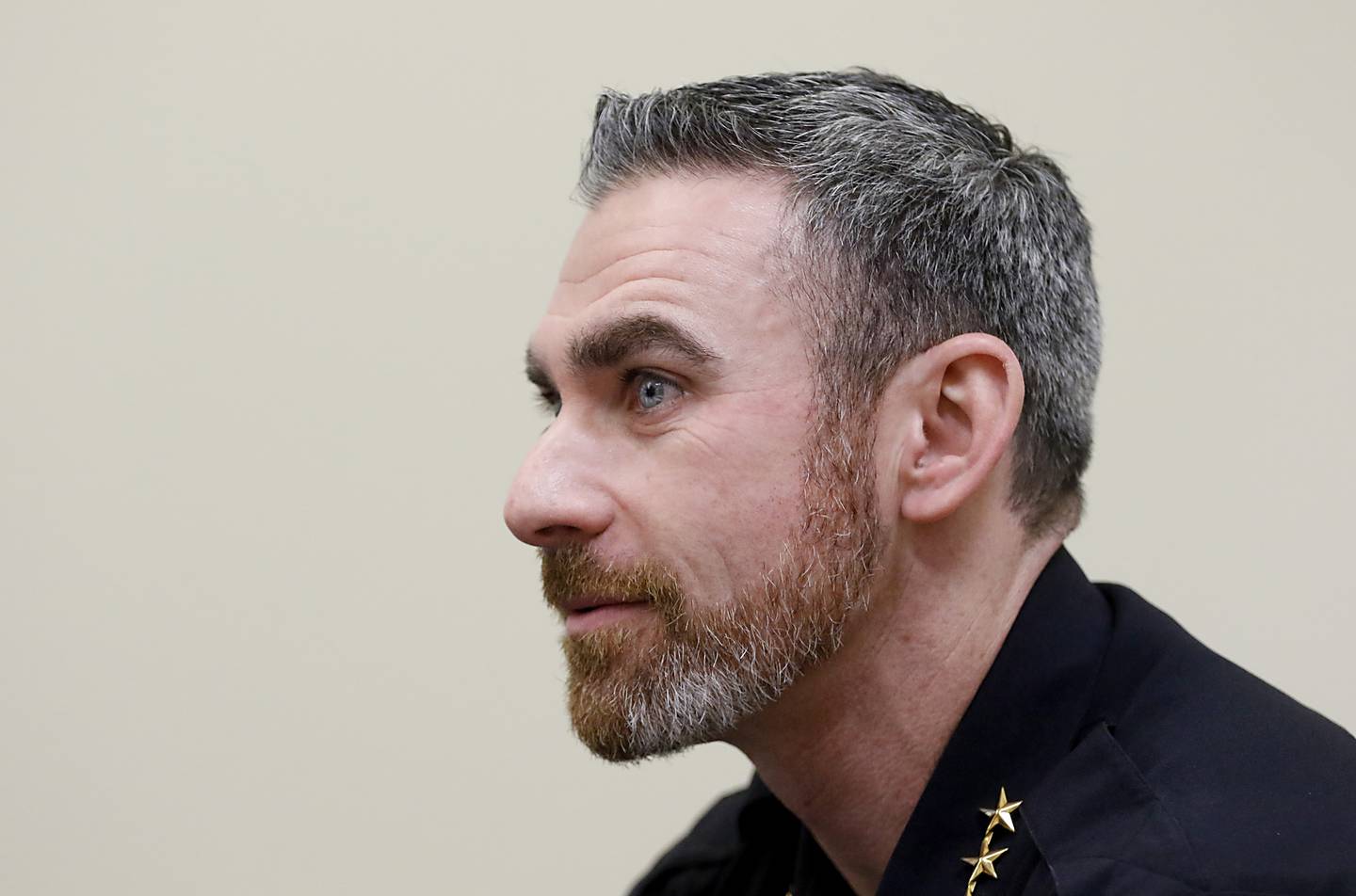 McHenry County Sheriff Robb Tadelman listens to  Algonquin Police Chief John Bucci speak Wednesday, Dec. 7, 2022, to a class in the Ted Spella Leadership School at the Algonquin Village Hall, 2200 Harnish Drive, in Algonquin.