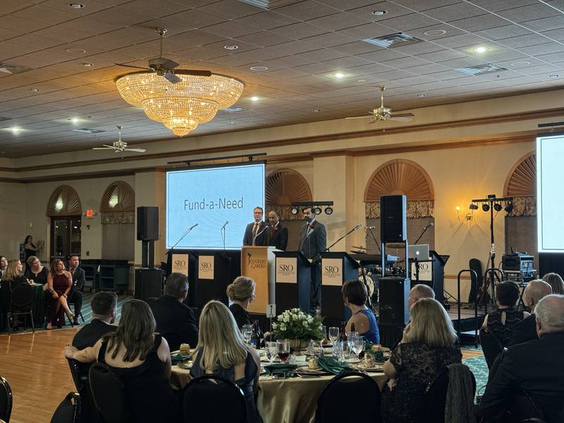 Dr. Mostafa Ghanin (left), Dr. Syed Ahmed and Dr. Athar Saeed address the crowd at the 54th Annual Morris Hospital Auxiliary gala.