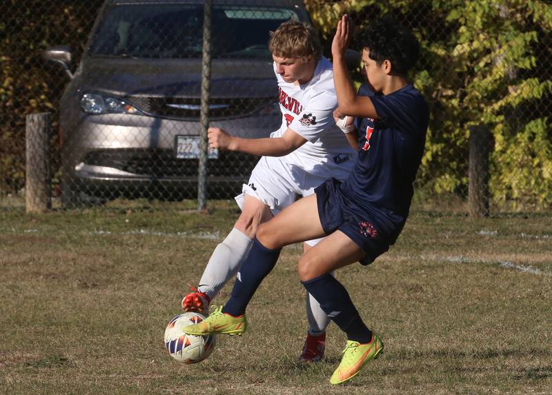 Earlville's Scott Brandt and DePue/Hall's Pedro Lopez battle for the ball during the Class 1A Regional quarterfinal game on Wednesday, Oct. 16, 2024 in DePue.