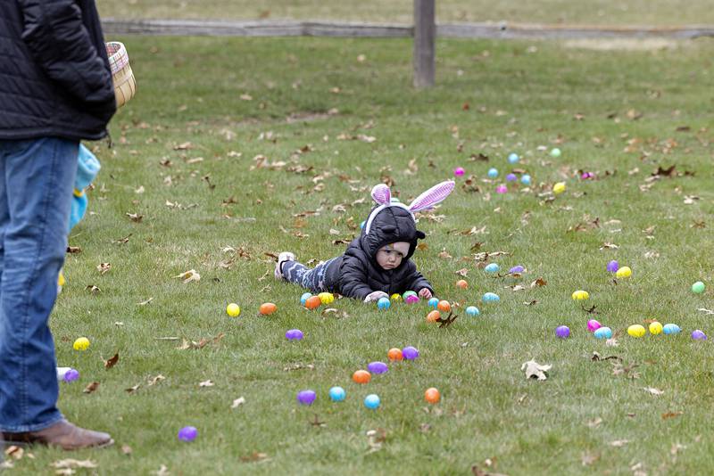 Blayke Dean, 10 months, of Rock Falls hangs with the eggs Saturday, April 1, 2023 at Centennial Park in Rock Falls.