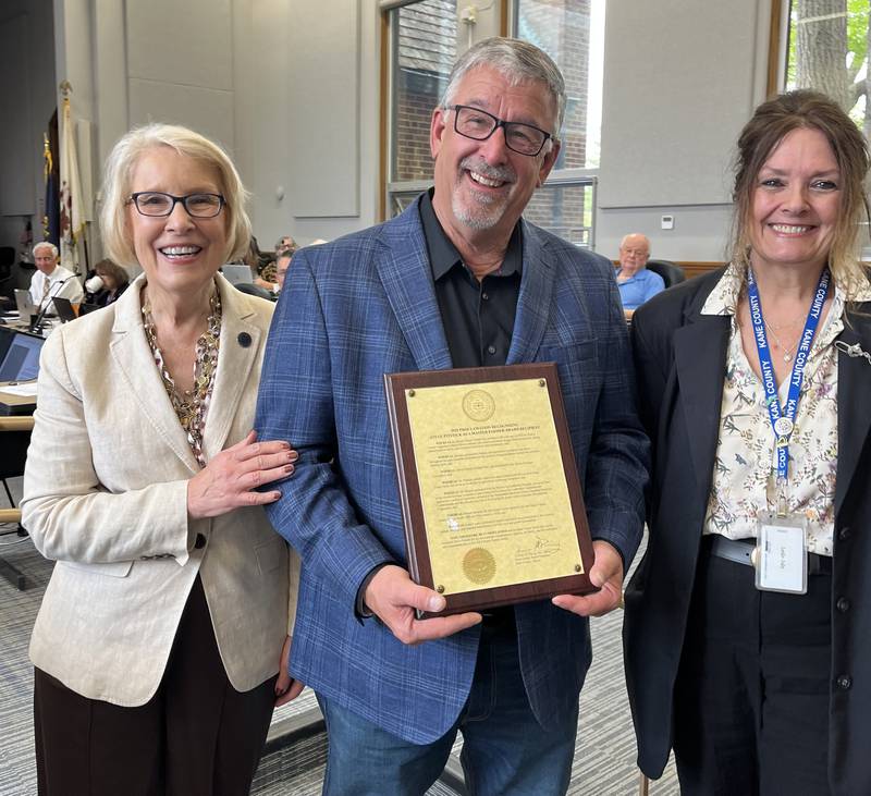 Kane County Board Chair Corinne Pierog with Maple Park farmer Steve Pitstick and Board Member Leslie Juby, D-Geneva. The board issued a congratulatory proclamation upon Pitstick for him receiving the 2025 Master Farmer Award, from Prairie Farmer magazine. Pitstick is the third Kane farmer to receive the Master Farmer Award. Eldon Gould received it in 1982 and former board member Michael Kenyon in 2014.