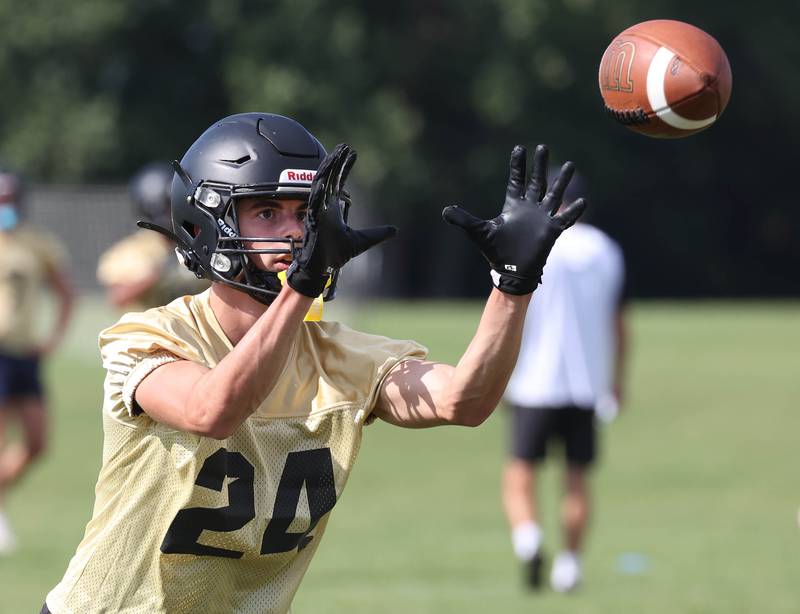 Sycamore’s Crewe Bartelt makes a catch Monday, Aug. 11, 2025, during their first fall practice at the school.