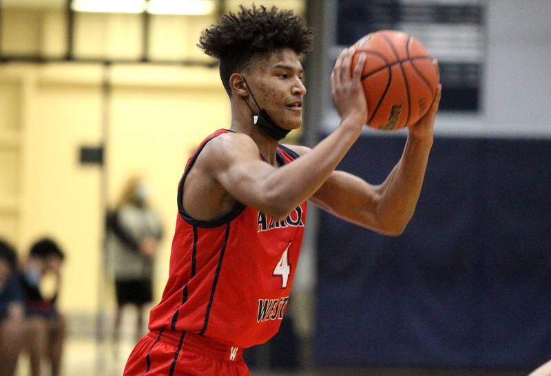 West Aurora’s Joshua Pickett looks to pass the ball during a game at Oswego East on Friday, Jan. 28, 2022.