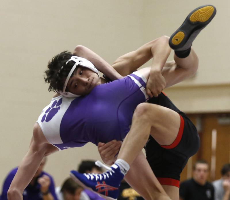 Huntley’s Collin Abordo tries to take down Hampshire's Lou Jensen during the 113-pound match of a Fox Valley Conference wrestling match Wednesday, Jan. 24, 2024, at Huntley High School.