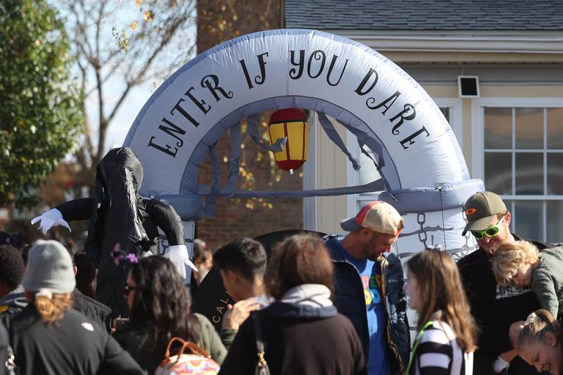 Hundreds line up to get candy and treats from the businesses along West Lockport Street at the annual Halloween Spooktacular in downtown Plainfield on Saturday, Oct. 28, 2023.