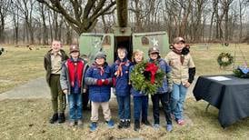 Local volunteers working to honor  veterans at Joliet’s Woodlawn Cemetery with Christmas wreaths