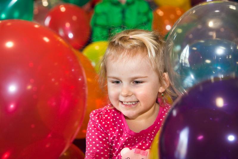 Julia Zelek, 4, of Joliet, plays in the balloon pit at the Hippity-Hop Easter Egg Hunt on April 4 at The Timbers of Shorewood retirement community in Shorewood.