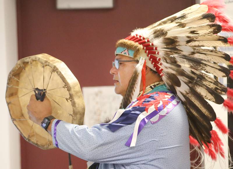 Gerald Savage, a tribal elder with the Ho-Chunk Nation, plays a hand drum "the heartbeat of Mother Earth" during a program on Monday, Aug. 4, at the Richard A. Mautino Memorial Library in Spring Valley. Chief Savage spoke to about 40 people about the history of the Ho-Chunk Tribe, Native American instruments, stories and more. Chief Savage is an Illinois Humanities Road Scholar who speaks across the State and Wisconsin.